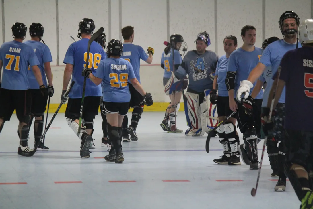 An adult co-ed league team on the floor after a game at the Bridgeville HockeyPlex